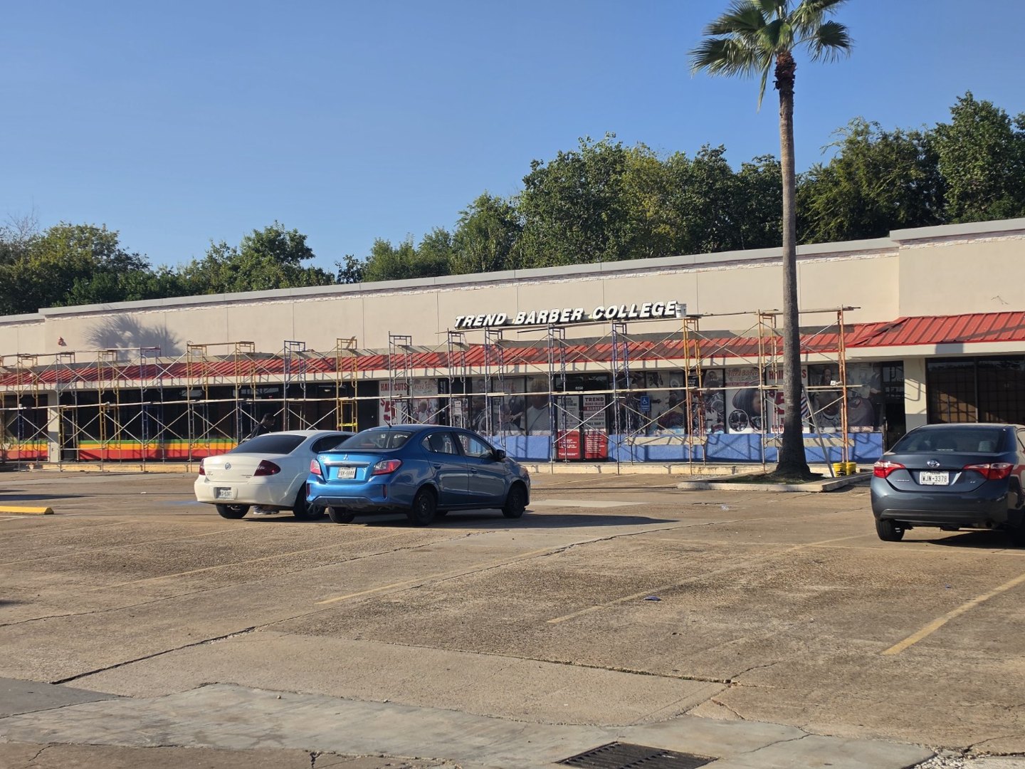Commercial facade work — Work in progress · scaffolding in place