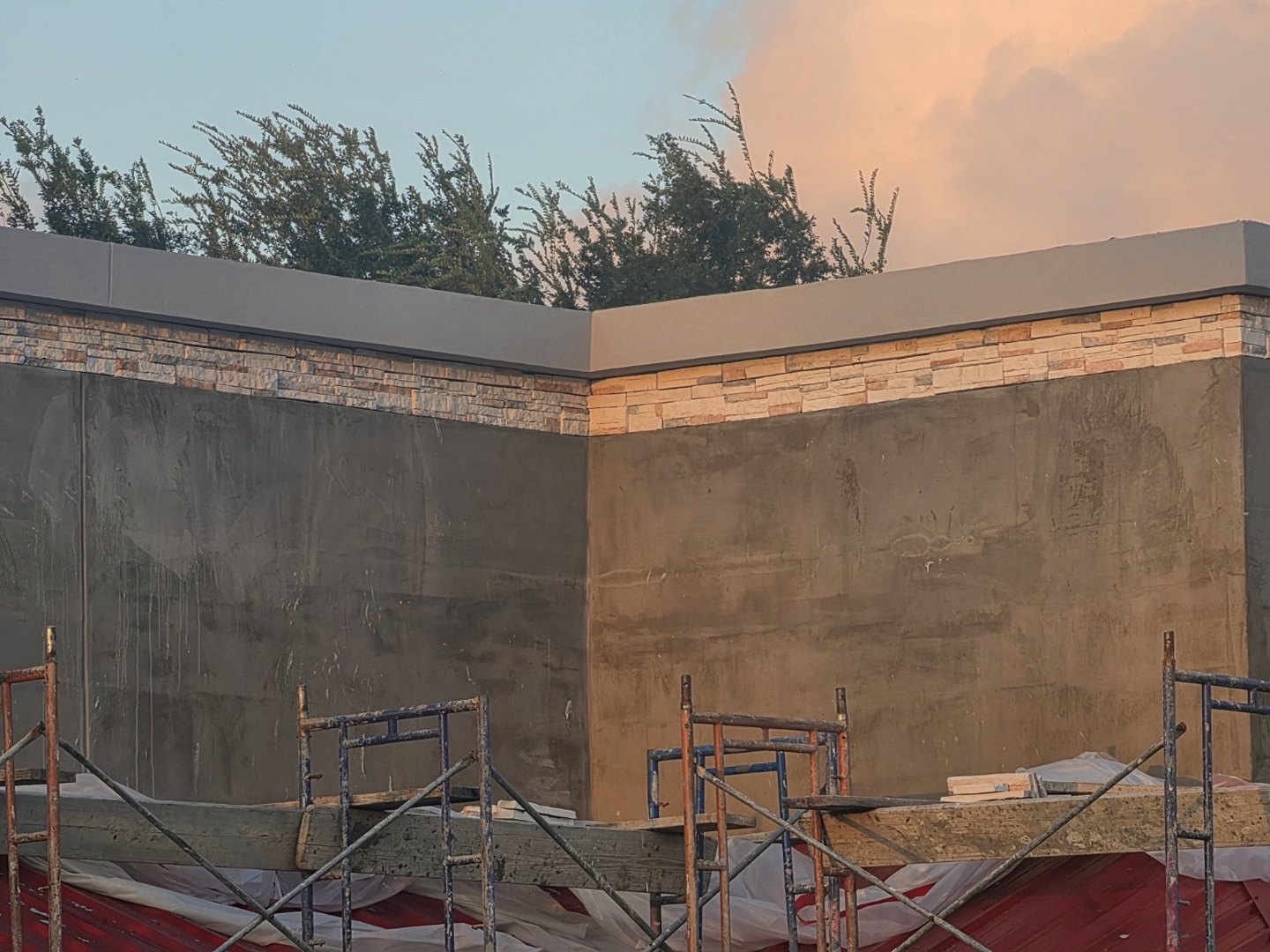 Stucco and stone detail — Work in progress · decorative stone band